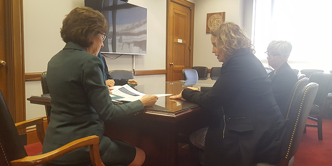 Regan Gallagher, DO (right) discusses the Cancer Care Planning and Communications Act  with Senator Susan Collins (Maine)